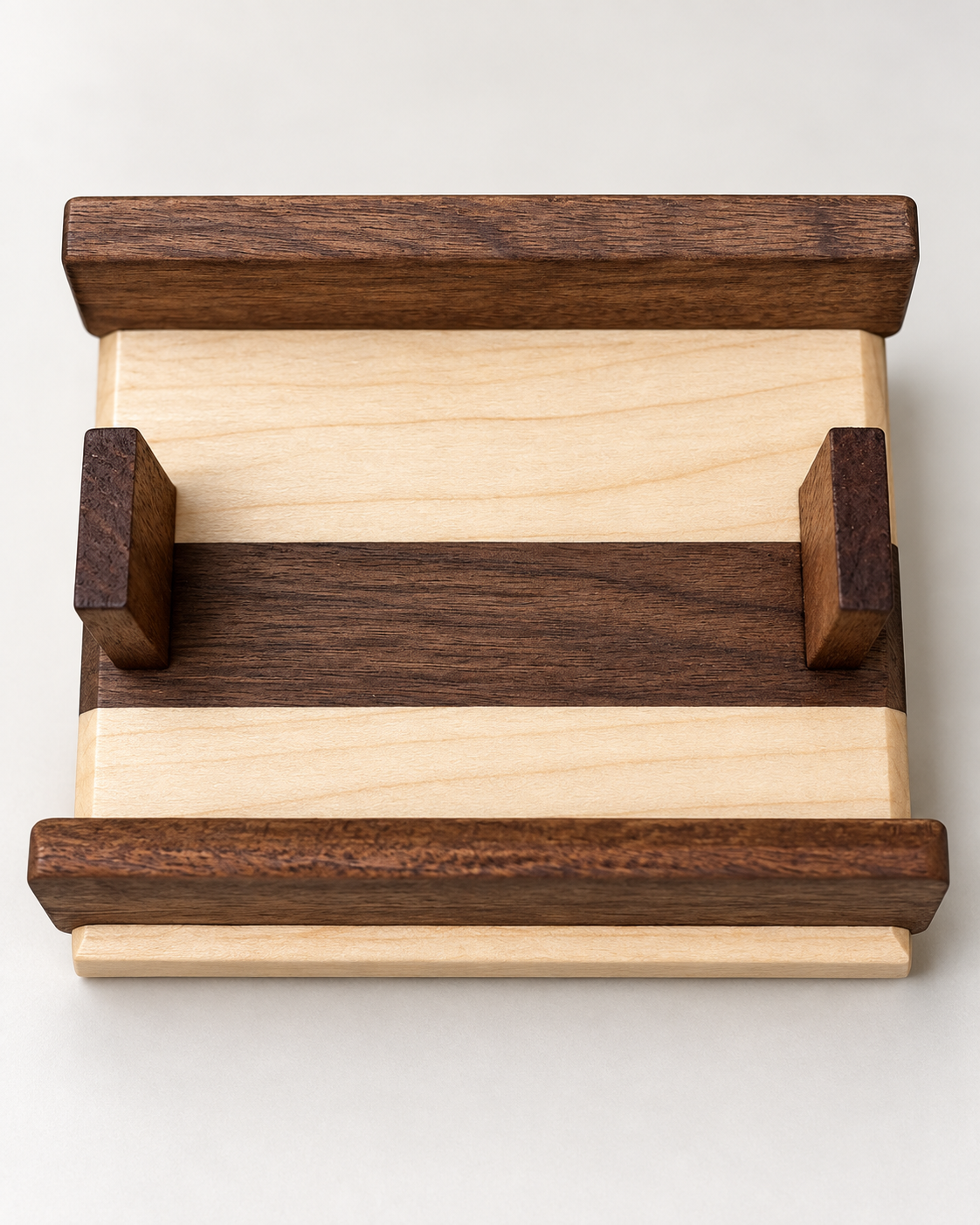 Studio detail of hard maple and black walnut coaster holder