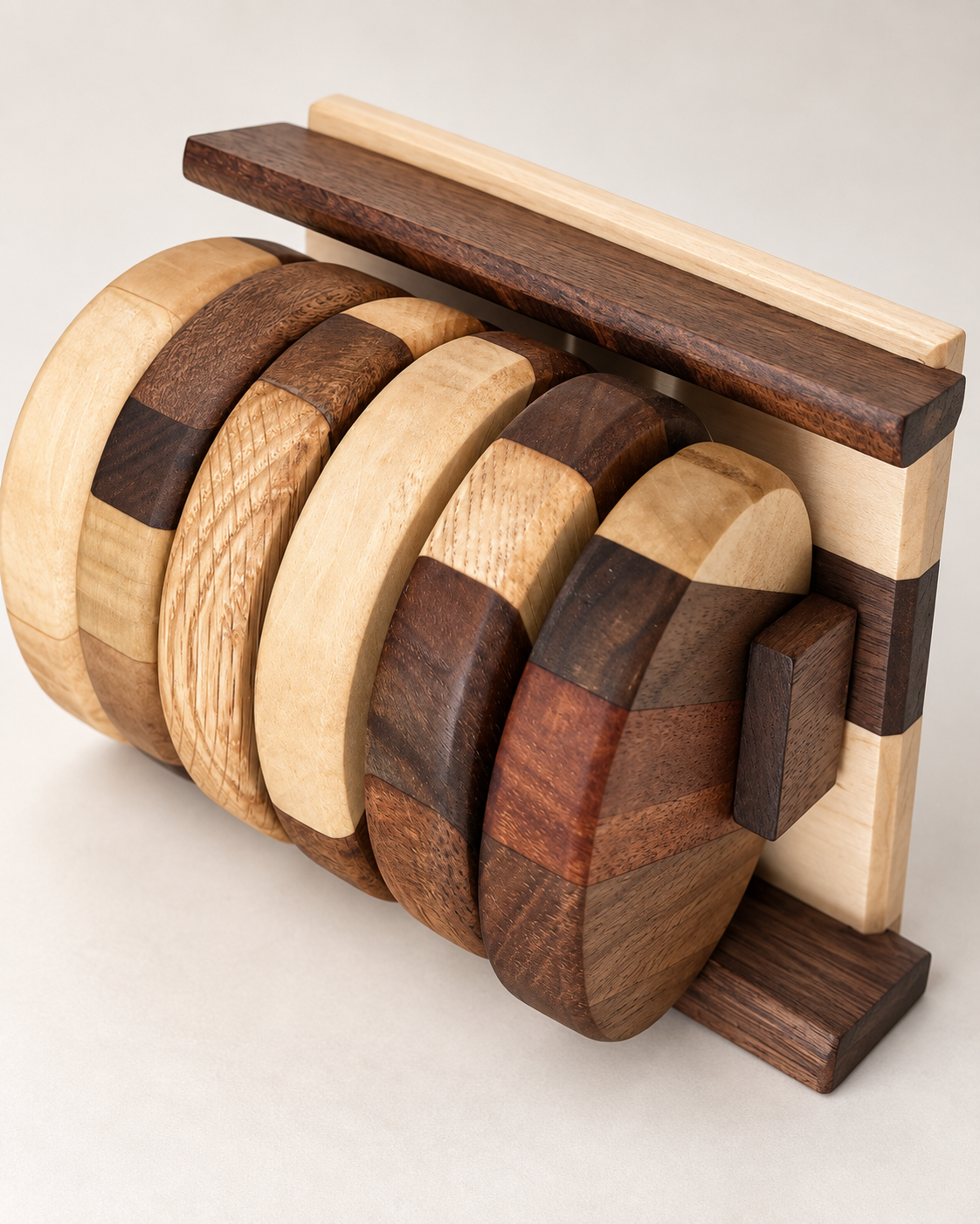 Angled studio photo of mixed hardwood coasters in matching holder